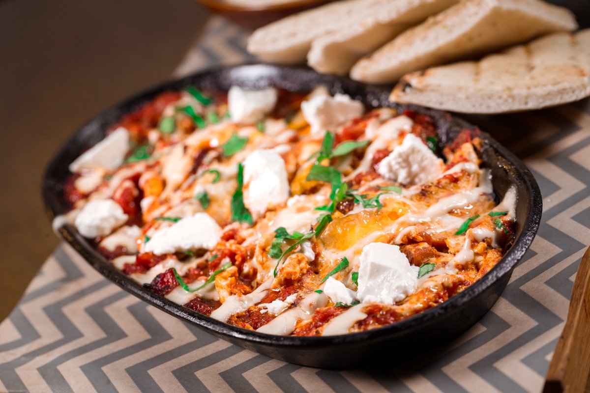 zalagrill's tweet photo. Our feta shakshuka is a delicious dish of taboon baked tomato sauce, with runny poached eggs and tahini. Enjoy it with grilled pita, salad and homemade hummus. 

#ZalaGrill https://t.co/fiJpKvNYAC