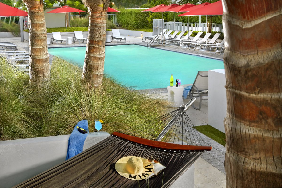 Res_InnSurfside's tweet photo. Make it a lucky Friday the 13th relaxing in one of our rooftop hammocks. #ResidenceInn #FoundInMiami https://t.co/MxYSPQJDPg