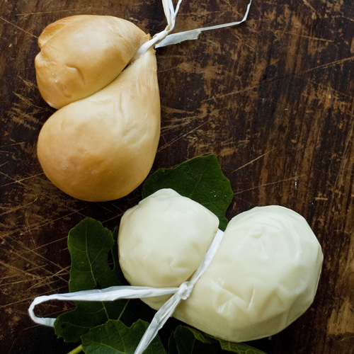 A personal favorite of mine, Scamorza is made by tying a fresh mozzarella ball and hanging it to dry. After drying, the cheese is then packaged immediately. Scamorza can be used in the same dishes as fresh mozzarella, but since it is dried it is firmer, shreds exceptionally well