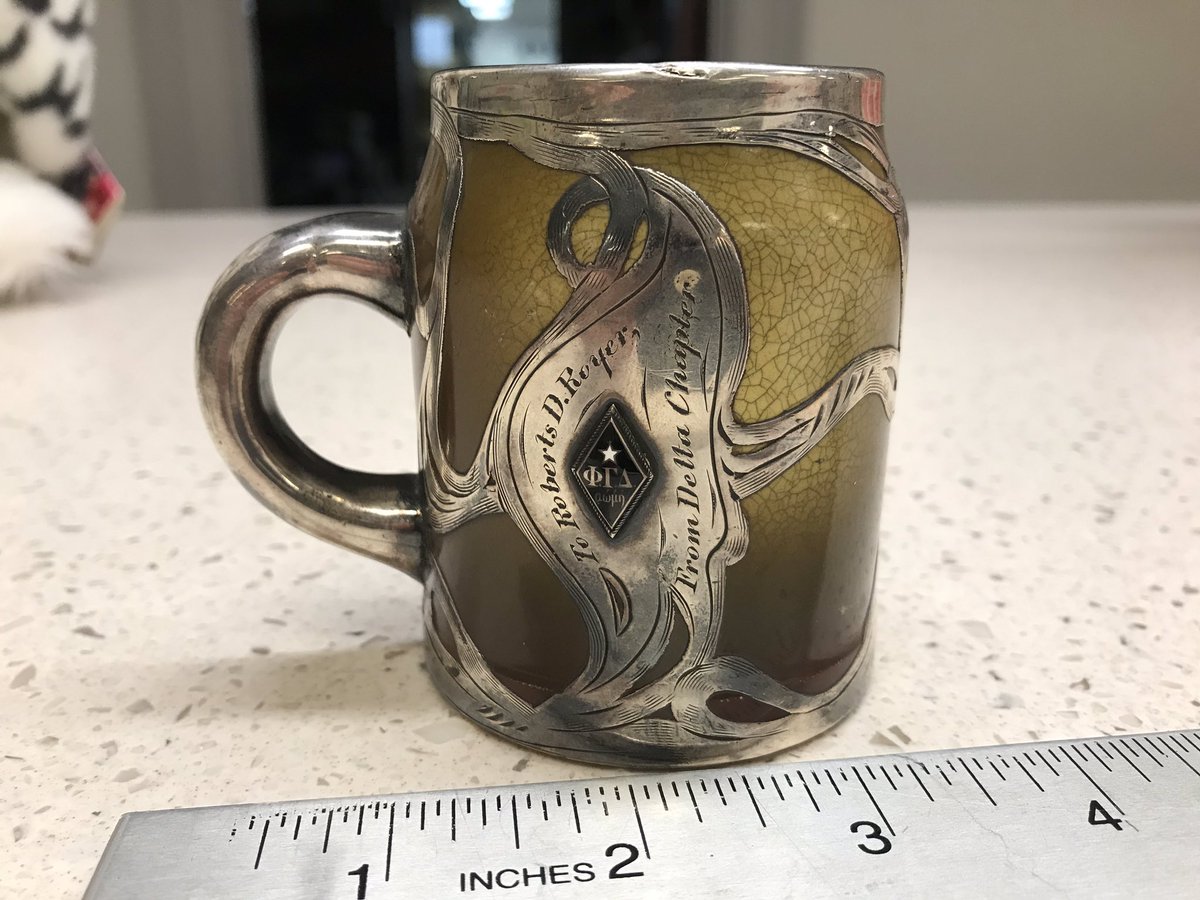 PhiGamArchives's tweet photo. Just in: Fabulous ceramic mug with silver inlay with mounted badge, given to a 1905 @Bucknell_Fiji, probably for his graduation. Loan from Sam Richwine (UGA 1973). #ArchivesWeekend #PhiGam #phigammadelta https://t.co/1m1nsPOG2q