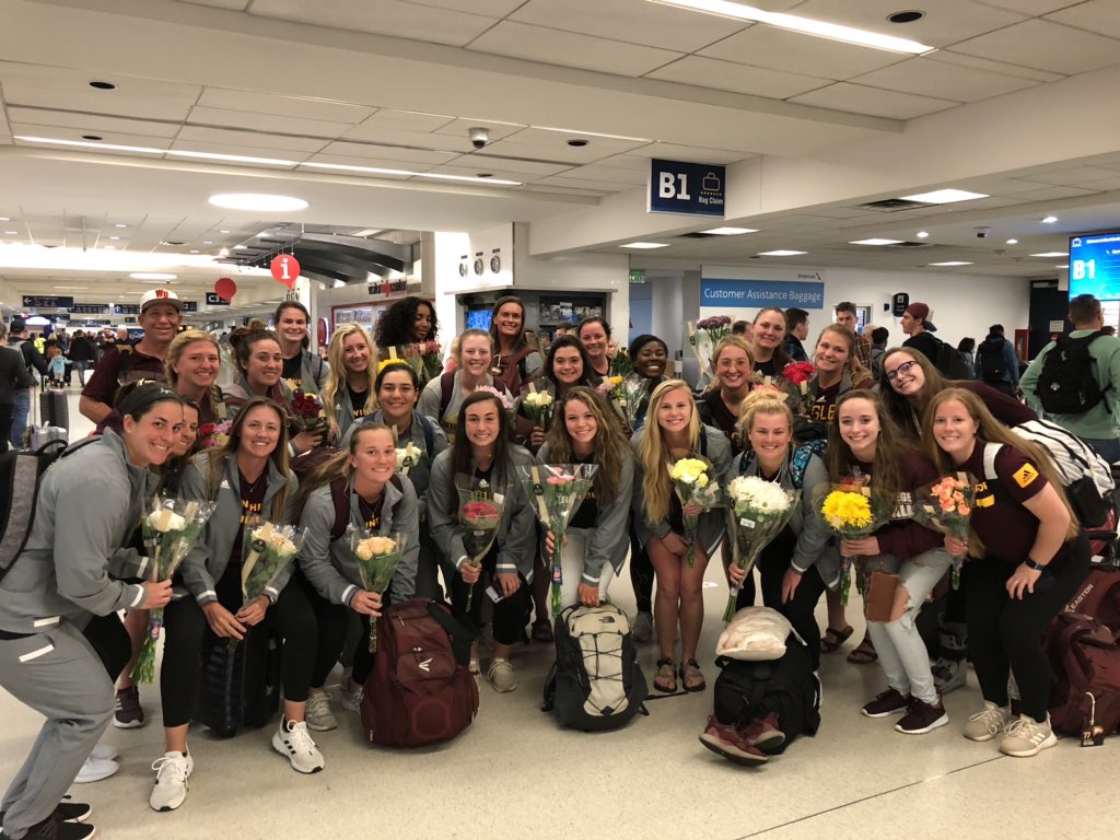 Definition of Winthrop Family: <a href="/CoachWThees/">Windy Thees</a> daughters Megan and Ally meeting our flight with flowers, smiles and hugs for entire <a href="/Winthropsoftbal/">Winthrop Softball</a> travel party!  💛🦅🥎 #RockTheHill 🥎🦅 💛#EverStand