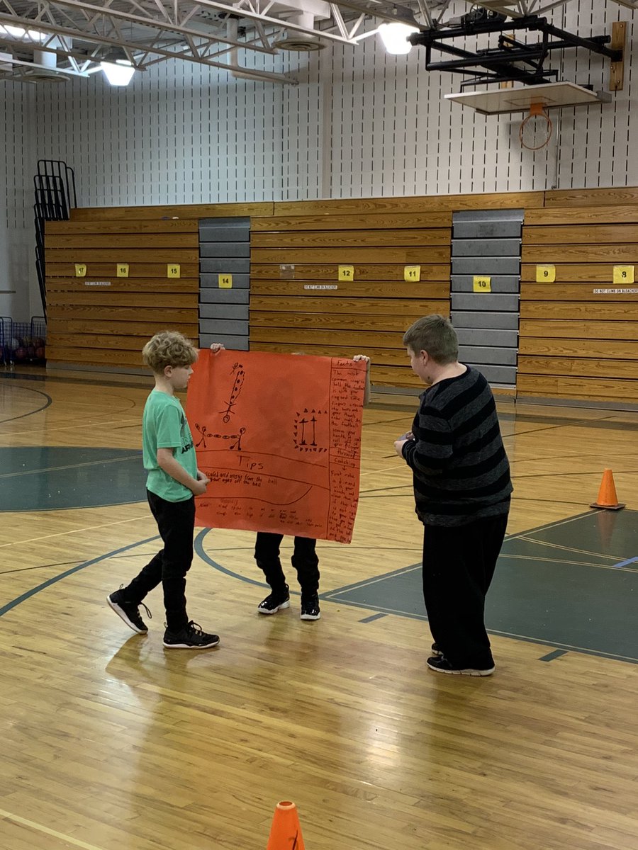 kierclass's tweet image. Aiden showed the class how to hold and throw a football. He also set up stations for students to warm up and stretch. Nice job Aiden! #thirdatbis