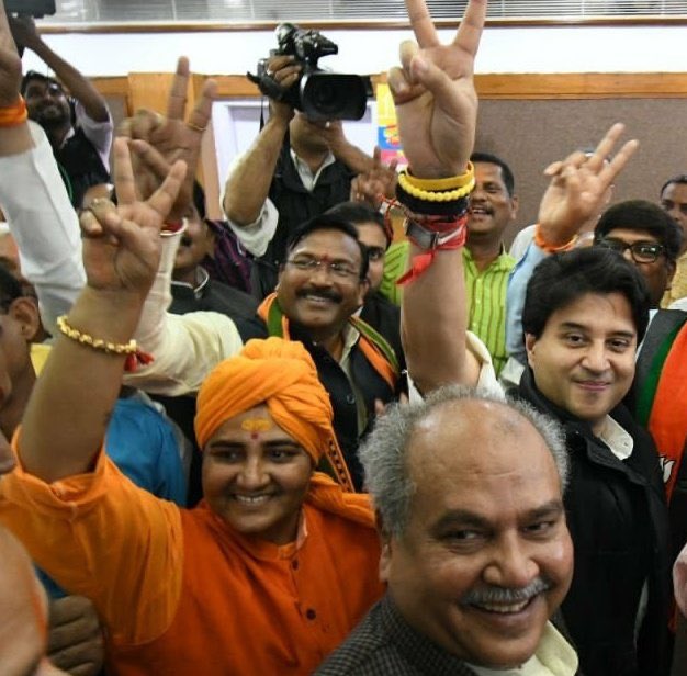 RanaAyyub's tweet photo. Jyotiraditya Scindia who has been with the Congress for decades flashing the victory sign with terror accused Pragya Thakur. This image speaks volumes of the so called defenders of secularism in India. https://t.co/UmCZmnoX86