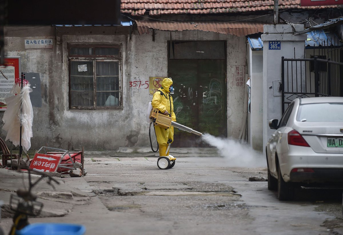 quixoticgeek's tweet photo. A man in a hazmat suit on a hoverboard fumigating a street... This is not quite the 2020 I was expecting... https://t.co/i7kS8f9Thh