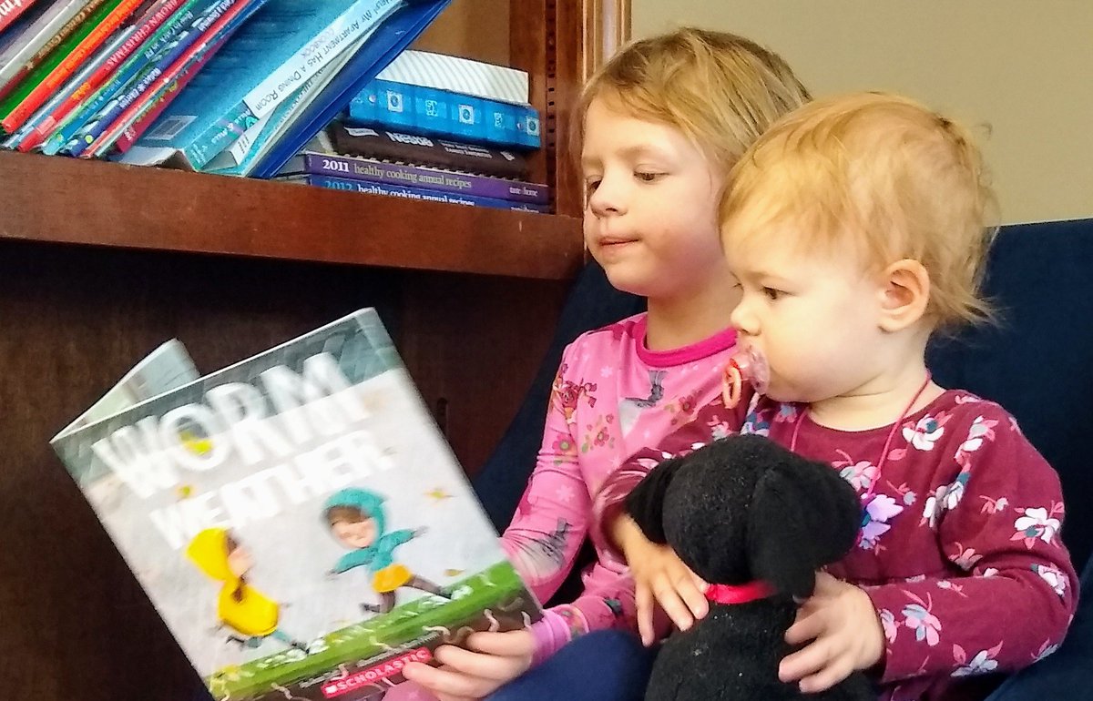 My youngest loves reading at school, in her pajamas, and most of all she loves reading with her family.  Modeling reading and having access to books is essential for growing readers. #sisters #readers