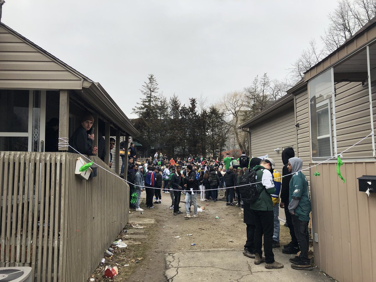 that_phidoan's tweet photo. Weekend before St. Patrick’s Day. Party being held in Hawthorn St area of Waterloo. Police are patrolling the area as well. Tons of garbage on the ground @570NEWS https://t.co/uthi1AJKHZ