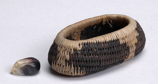 here's another miniature Pomo basket, a bit bigger (half an inch tall, just over an inch wide), but with a very satisfying shape