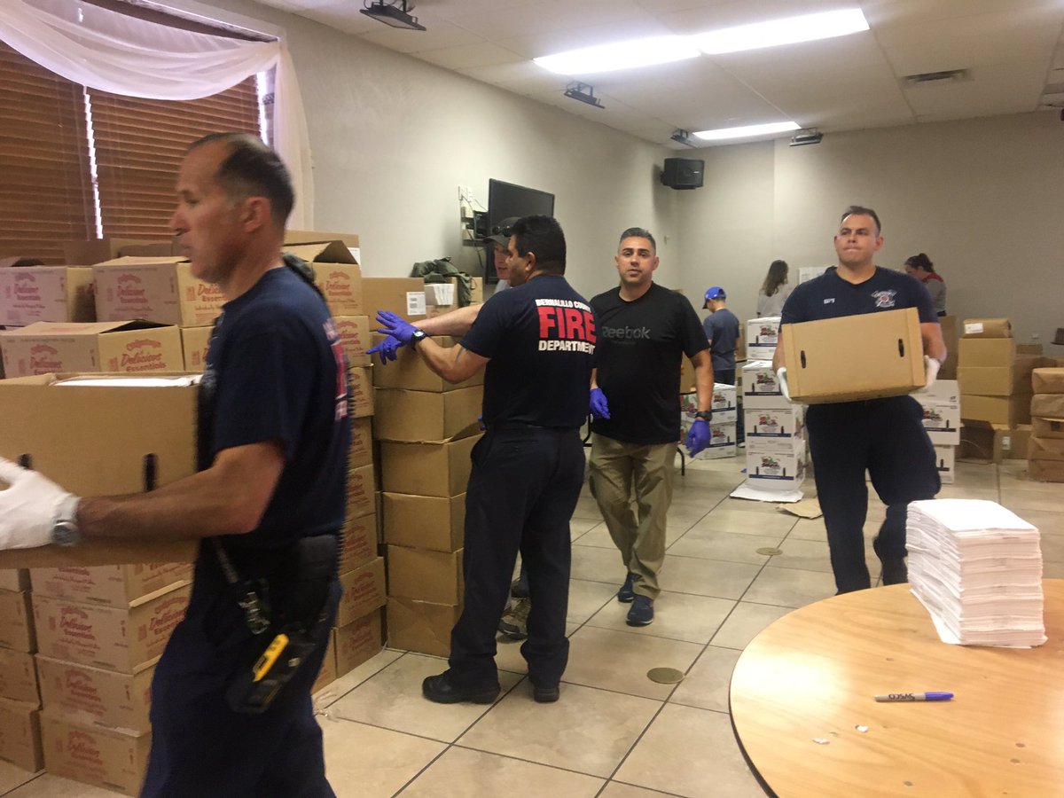 abqfire's tweet photo. Several Albuquerque Fire Rescue and @bcfirerescue units assisted with packing lunches for @ABQschools students provided by @syscofoods. These are your local first responders combining their efforts and working together for the greater good of our community. @iafflocal244 https://t.co/jk8cAsUaIU