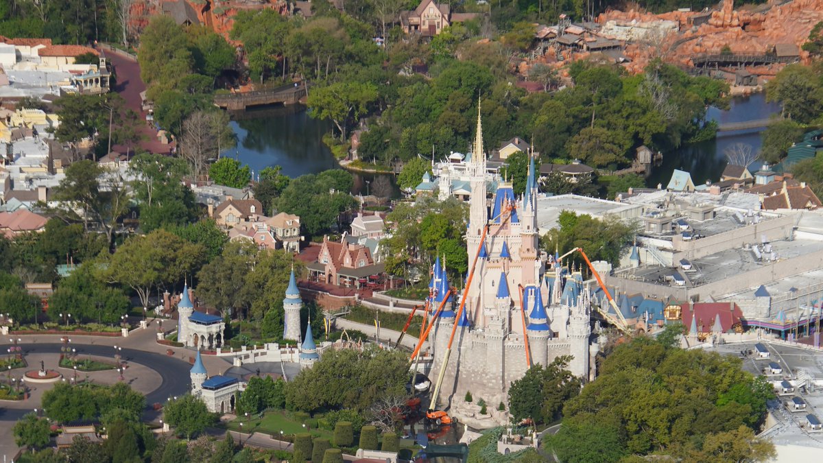 bioreconstruct's tweet image. Aerial view of Cinderella Castle being painted for the 50th anniversary. Note the rich Royal Blue on roofs, and a new pink shade in some sections.

Today is also first day WDW parks are closed due to #COVID19 and Magic Kingdom walkways are empty.