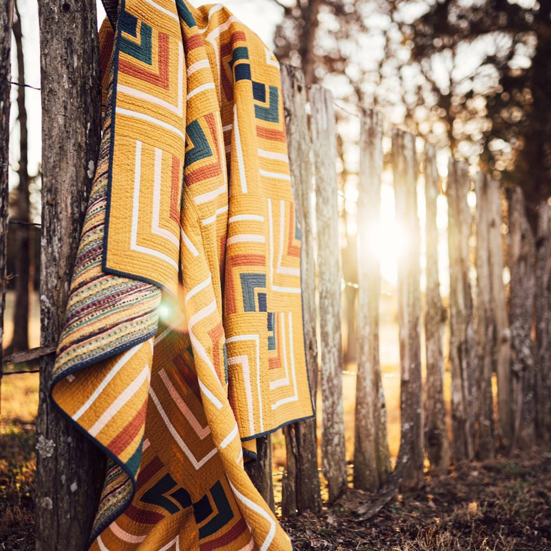 ArtGalleryFab's tweet photo. ✨We can’t stop staring at these glorious pictures of HoffMama Companys latest quilt pattern release #cabinfadequilt all made of #PureSolids.💕She used the colors in the “Trinkets Bold” print from “Legendary” fabrics to tie in all the colors from her quilt top.💌
#AGFMakerMonday https://t.co/vSm3OFApK6