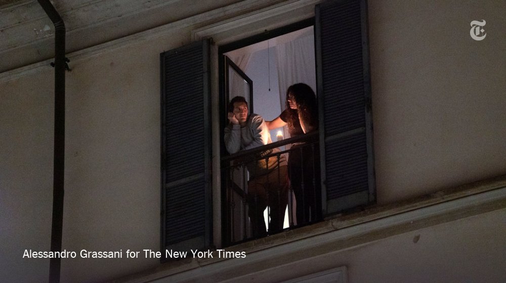 nytimes's tweet image. The scene in Milan on Sunday. In Italy, people are lighting candles in windows and balconies as a show of resilience against a coronavirus outbreak that has left 60 million Italians essentially under house arrest. nyti.ms/2TTBhR6