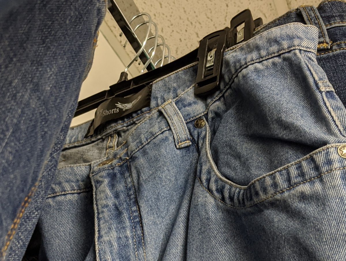 All the jeans are different, so they weren't mass manufactured. Looking closely, the tags are either blacked out, or large enough to cover the original tag. These are used jeans that have been shipped from the USA to a factory overseas, turned into jean shorts, and shipped back.