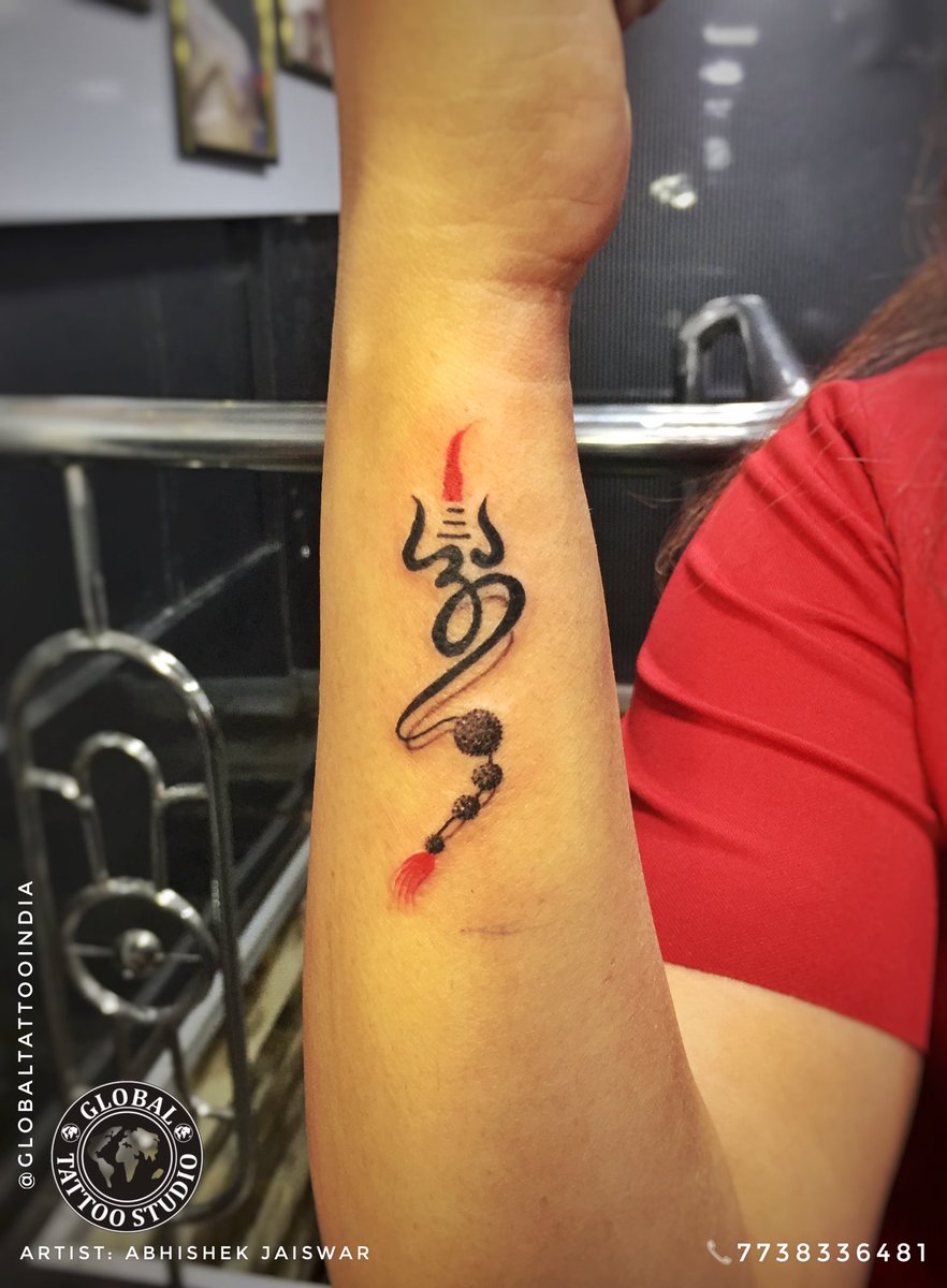 Small om and trishul tattoo done at xpose tattoos jaipur