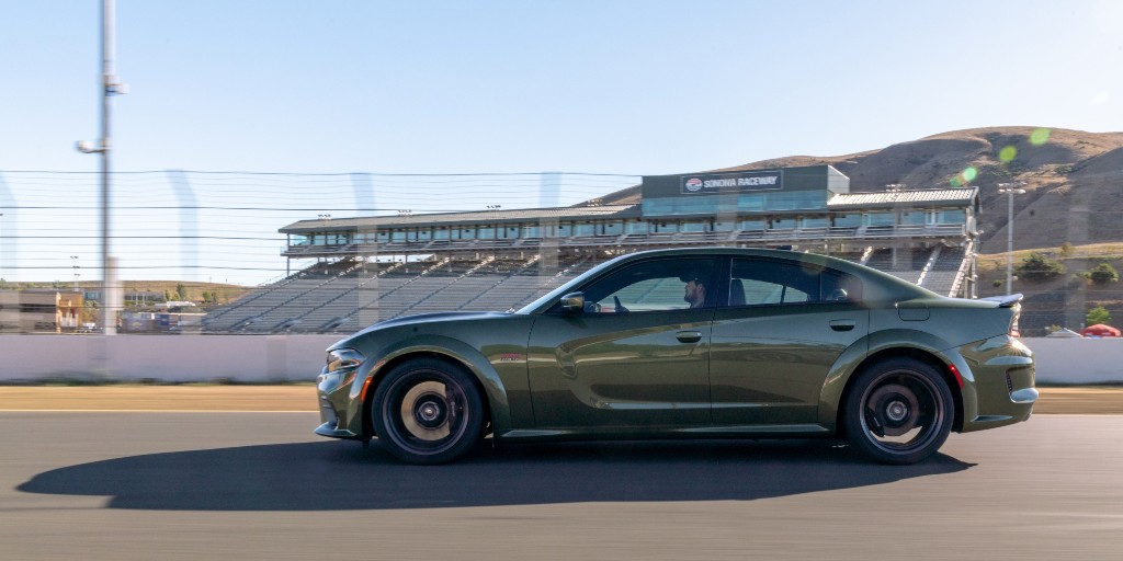 StellantisNA's tweet photo. When you’re bred to perform, luck has nothing to do with it: the @Dodge #Charger Scat Pack Widebody in F8 Green. #StPatricksDay https://t.co/2soApwEMSF