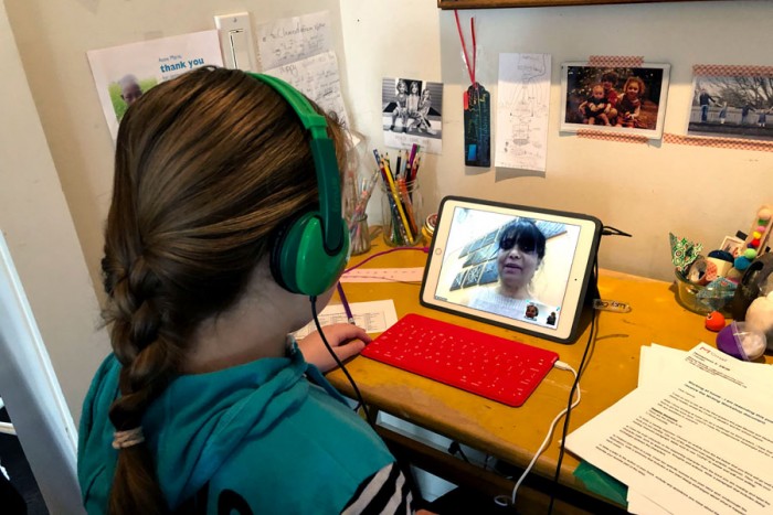 educationweek's tweet photo. In this photo provided by Anne Marie Canlis, Clementine Canlis, of Seattle, watches an online lecture after her private school closed for five weeks.

See more photos of students' new normal during the #coronavirusoutbreak.https://t.co/ZVp9DxuflZ https://t.co/ll8PdsJNGk