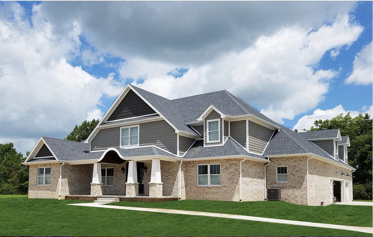 RedRiverBrick's tweet photo. #HappyStPatricksDay! We love how the green grass pops next to the soft tone of our #Walmac style brick. #HomeExterior https://t.co/S0Tnff9ULL