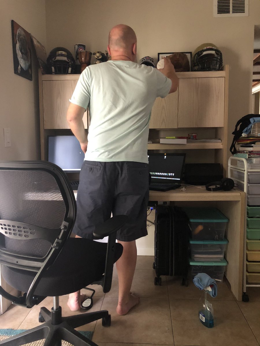 QuarantinedLove's tweet photo. At least my coworker has his priorities straight, to hell with the computer logistics, let’s make sure our 2016 Cubs decor is well dusted.  #quarantinedwithlove https://t.co/3LdPNpifEl