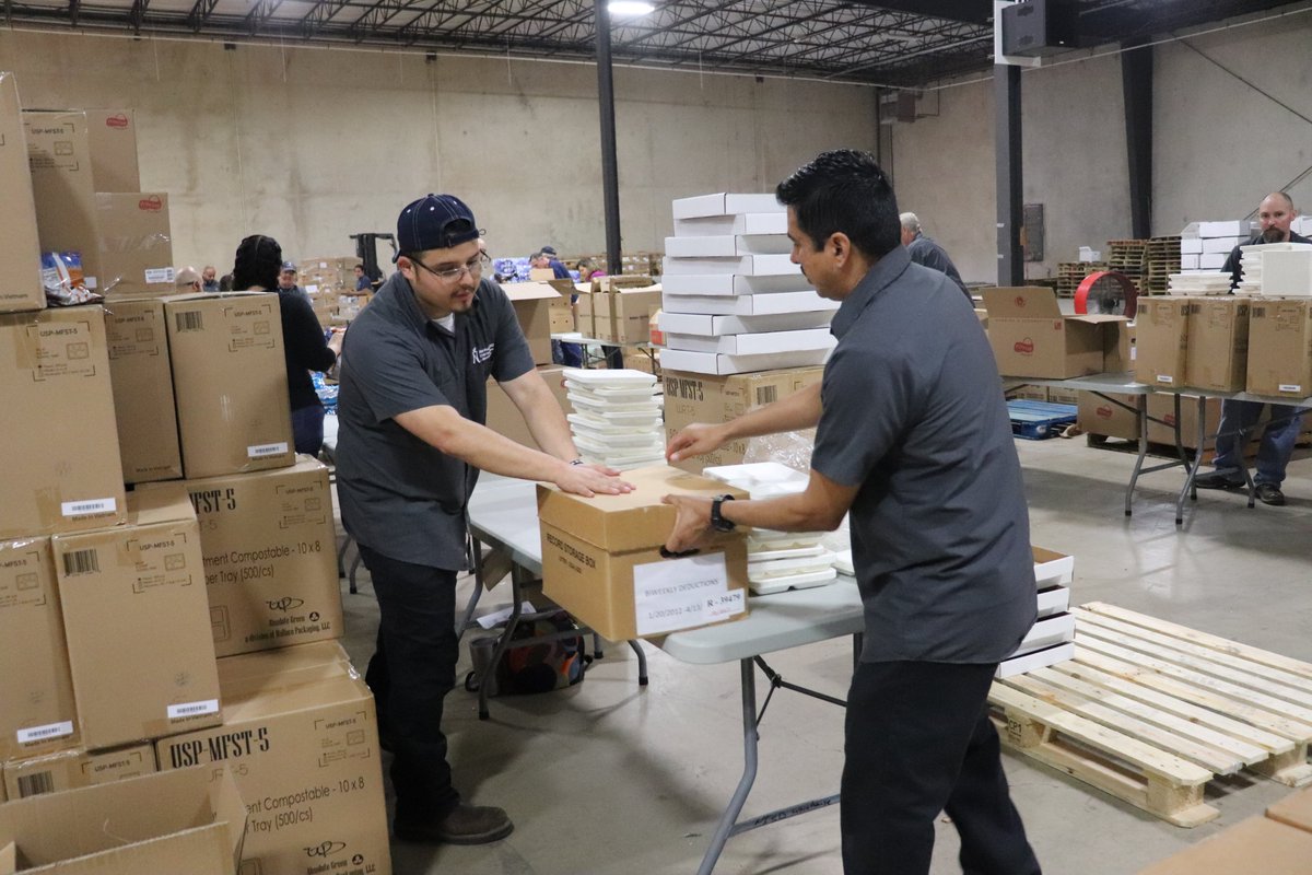 NISD's tweet photo. #NISDLegends- Mr. Rogers told us to "look for the helpers." These are the Child Nutrition Department helpers assembling food kits. They began early this morning &amp; packed more than 300 boxes an hour. Distribution begins tomorrow at 8am. Details- https://t.co/Au74BgNoFi https://t.co/rtm4fXC8Aq