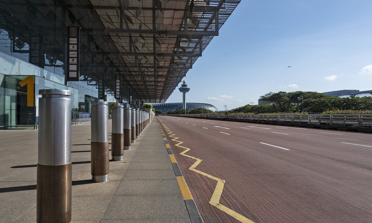 Sanpixs's tweet photo. Made a trip to the #singaporechangiAirport this morning to photograph the impact of Travel Restrictions set by the government due to the #COVID19 . Haven't seen this kind of emptiness and serenity in one of the World's busiest airport before.  #sharethemoment https://t.co/oZgLxbq3ze