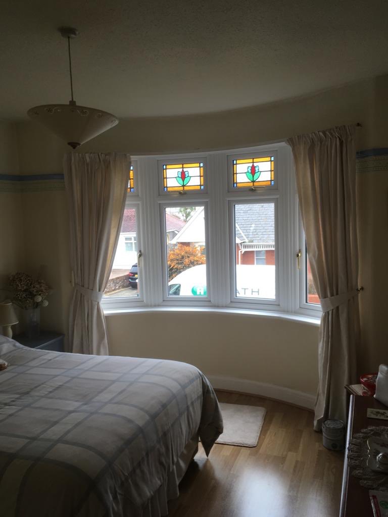 Heathwindows80's tweet photo. Lovely retained original stained glass from 1930’s in new upvc windows installed in Penarth. #retainedstains #encapsulatedstainedglass #stainedglass #penarth #upvcwindows #windows https://t.co/fzsFaMpqbm