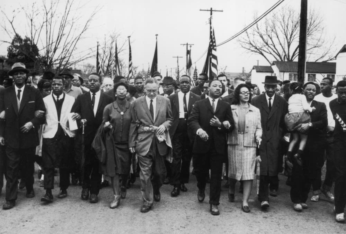 Photo of marchers in Alabama in 1965, including A. Philip Randolph, John Lewis, Martin Luther King Jr, and Coretta Scott King.