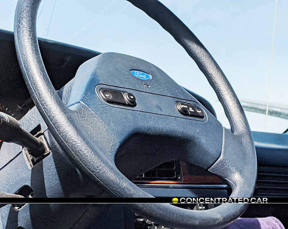 concentratedcar's tweet photo. @ford #taurus lx #1986 2/3: a-shaped wheel hub, fingertip cruise control buttons. https://t.co/ZUzOhpydHj