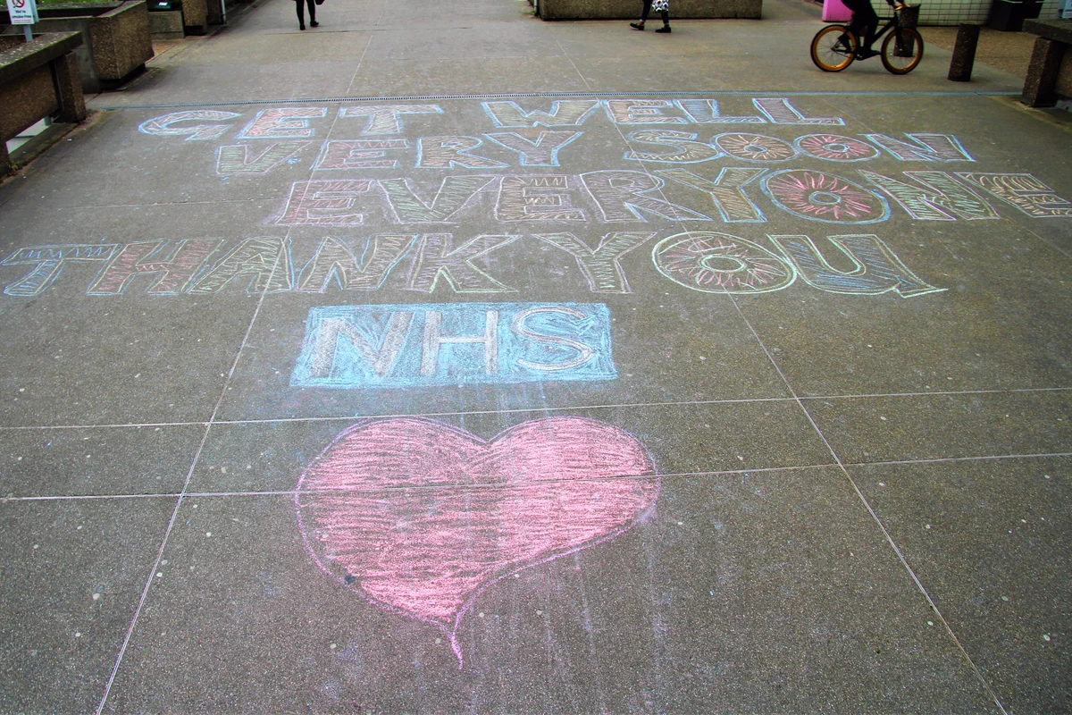 A message written in chalk on the ground outside St Thomas' Hospital "Get well very soon everyone. Thank you NHS"