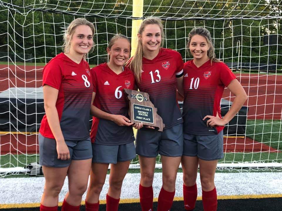 timisgrig22's tweet photo. Stuck at home and no sports for a while.... I'm gonna post a sports picture every day that is meaningful to me in some way. Today is Erin, Chloe, Gracie, and Zoe holding our district championship plaque last year. #dogpride https://t.co/cpPOkI0RQZ