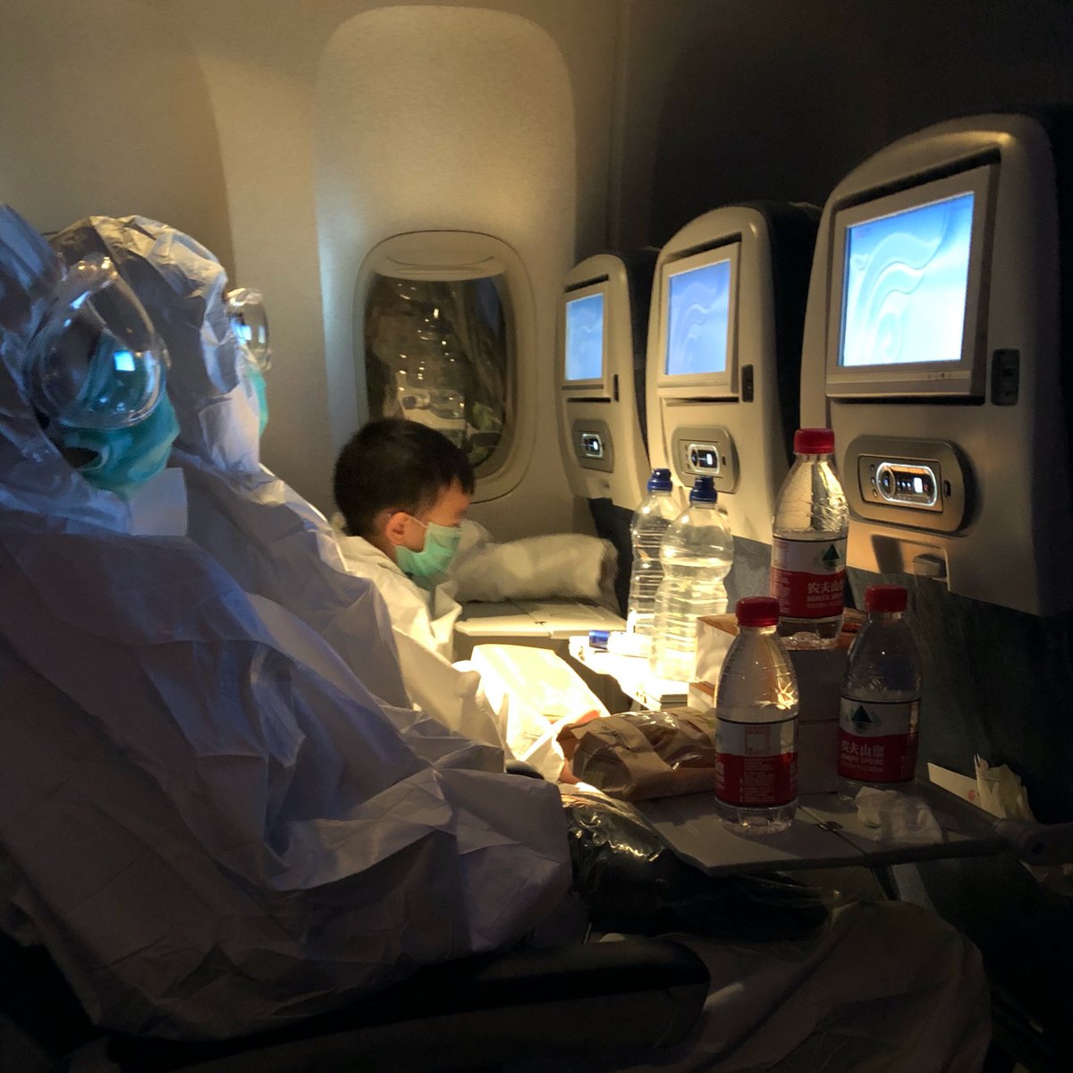 On the plane, we were all instructed to wear masks and everyone stuck to it (that also means everyone was prepared as no-one handed out masks). Our neighbors were fully covered (see photo) and we felt somewhat under-protected (though probably more comfortable). 6/n