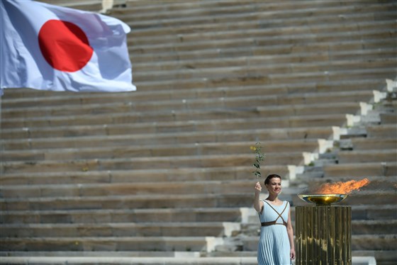 NBCNews's tweet photo. Olympic flame handed over to Japan for 2020 Summer Olympics in Tokyo, despite coronavirus outbreak. https://t.co/qCsOFKboO8 https://t.co/UyKy8he4UL