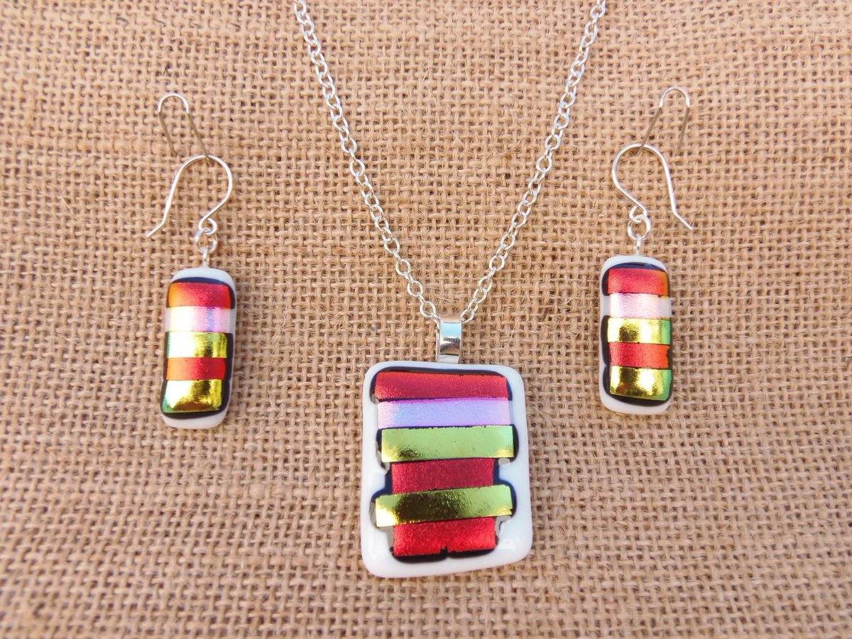 Excited to share the latest addition to my #etsy shop: Sterling silver and dichroic fused glass pendant and earring set etsy.me/2QpdAhq #red #gold #earrings #womengift #fusedglass #minimalist #rectangularpendant #stylishjewellery