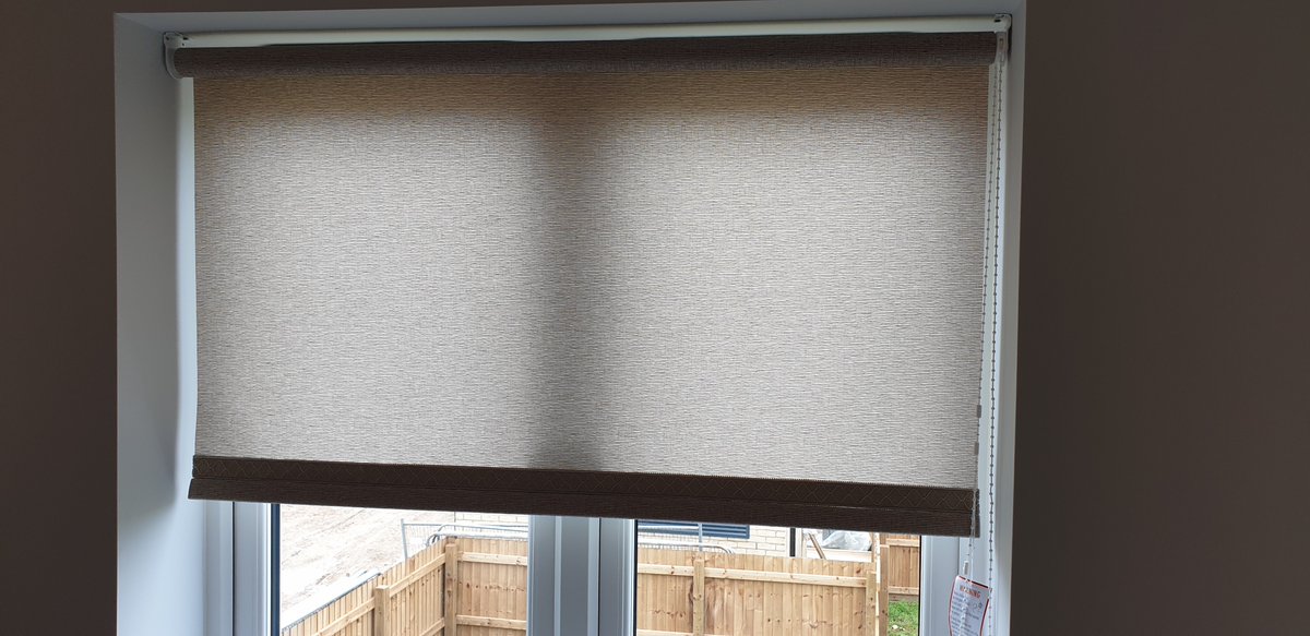 This #dimout #rollerblind filters #light and provides shade in a #study