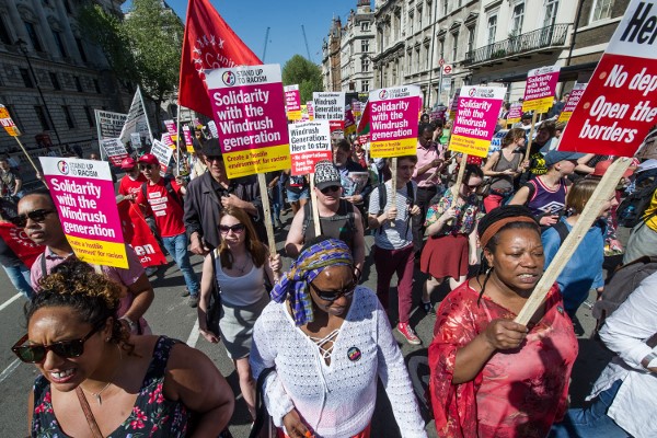 socialistworker's tweet photo. The Tories’ treatment of the Windrush generation of migrants was “consistent with some elements” of institutional racism, according to an official report. #WindrushReport #WindrushReview #WindrushScandal https://t.co/ph7byWYi8P https://t.co/HUlGFcD9te