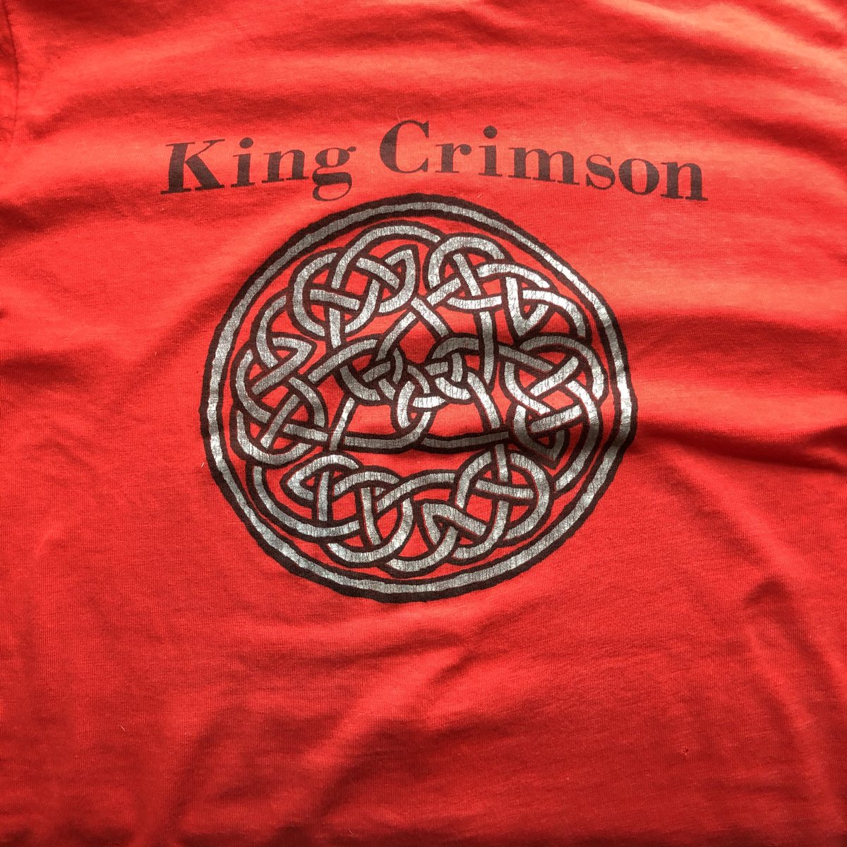 TheTedAllen's tweet photo. I was 20 when I bought this at an awesome #KingCrimson show at @TheVogue, great venue in Indianapolis. Drinking age was 21. Faked birth cert with whiteout &amp; a copier. Doubt that works any more...  @DGMHQ #IsolationLaundry #tshirtproblem https://t.co/kzgRH67V1V