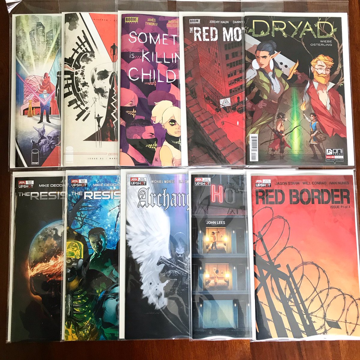NorthernBrogre's tweet photo. Made it to my LCS for my last NCBD for likely a very long time (😞): #Decorum (both covers), #SomethingIsKillingTheChildren, #TheRedMother, #Dryad, and all the @AWA_Studios/@Upshot_Studios launch titles — #TheResistance (both covers), #Archangel8, #Hotell, and #RedBorder. 🤘🏻🤘🏻 https://t.co/ybWznJ0HjC