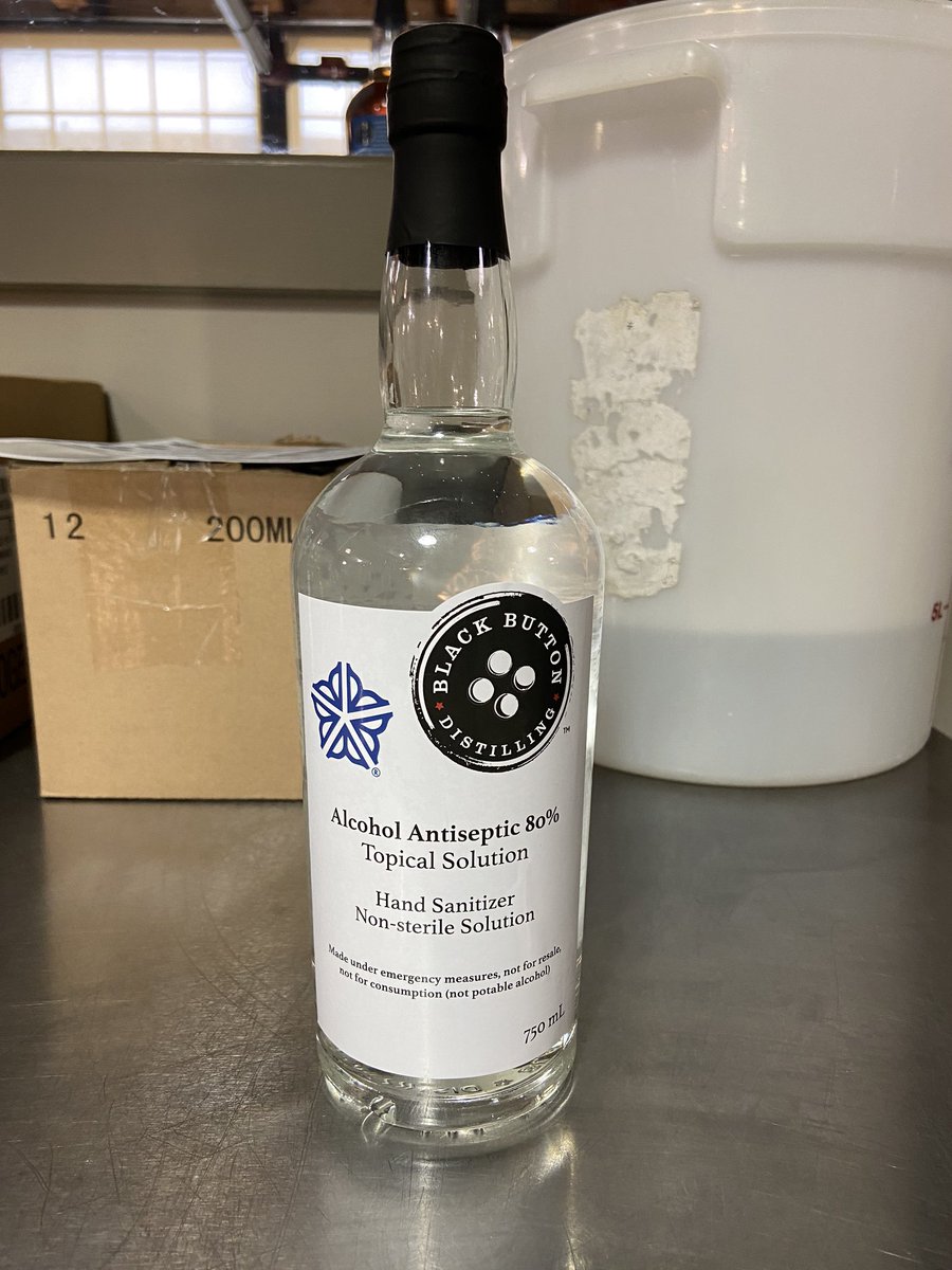 MarcCohenNY's tweet photo. You’re looking at the 1st bottle (from 6’ away with the master distiller) of the 1st batch of @RochesterChambr member @BlackButton85’s FDA approved hand sanitizer to help fill the #ROC community need. This is what it looks like when the community comes together in times of need! https://t.co/P81rlZDW7P