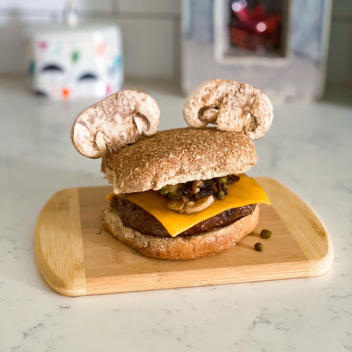 Disney Quarantine Food Festival lunch today!Angus burger on a wheat bun with mild cheddar, sautéed mushrooms and capers.
