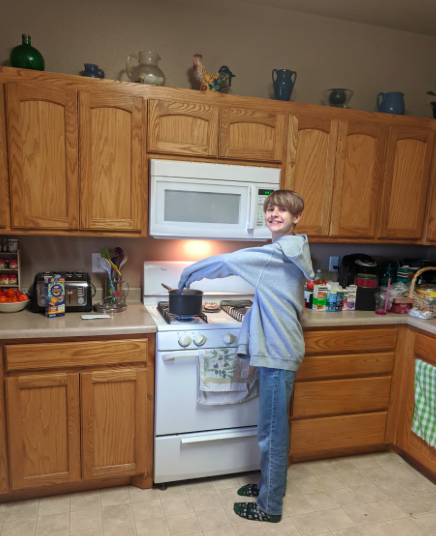TrumanTigers24's tweet photo. Kyle learning how to cook Mac & Cheese, learning about his Irish ancestry on St. Patrick's Day w/grandma. #VirtualSpiritWeek #ThunderInAction @APSLZ3 https://t.co/ubeH4SKAnV