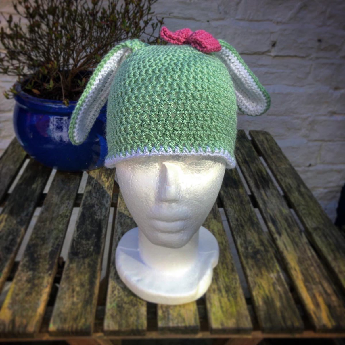TreacleKnits's tweet photo. Bunny hat for a little friend ☺️ Modelled by the tiny noggin of Arnold the Chinese polystyrene head 😂 #🐰 #hat #knitted #crochet #handmade #bunnyhat https://t.co/Yp3zYK4y0v