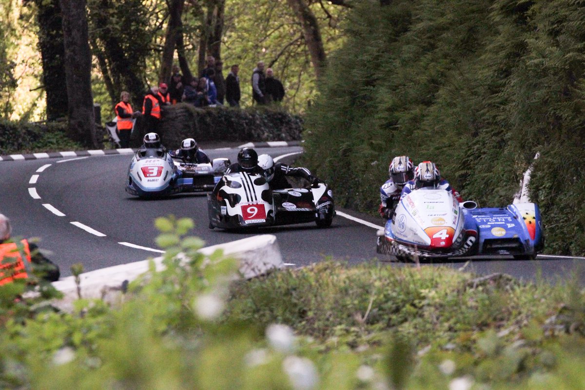 ⁦<a href="/ManxGrandPrix/">Manx Grand Prix Official</a>⁩ ⁦<a href="/S100isleofman/">Southern 100</a>⁩ ⁦<a href="/ManxRadioMSport/">Manx Radio Motorsport</a>⁩ ⁦<a href="/3WheelingTT/">3 Wheeling</a>⁩ ⁦<a href="/ttracesofficial/">Isle of Man TT Races</a>⁩ June 2015 Approach to Glen Helen ...you wait all day for one and then three come at the same time!
