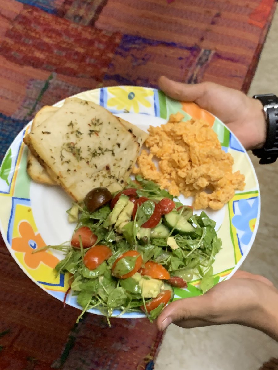 Dinner tonight. Salad with baby spinach, strawberries, cukes, grapes & capers dressing served with garlic bread and chilli scrambled eggs. Happy Friday people 