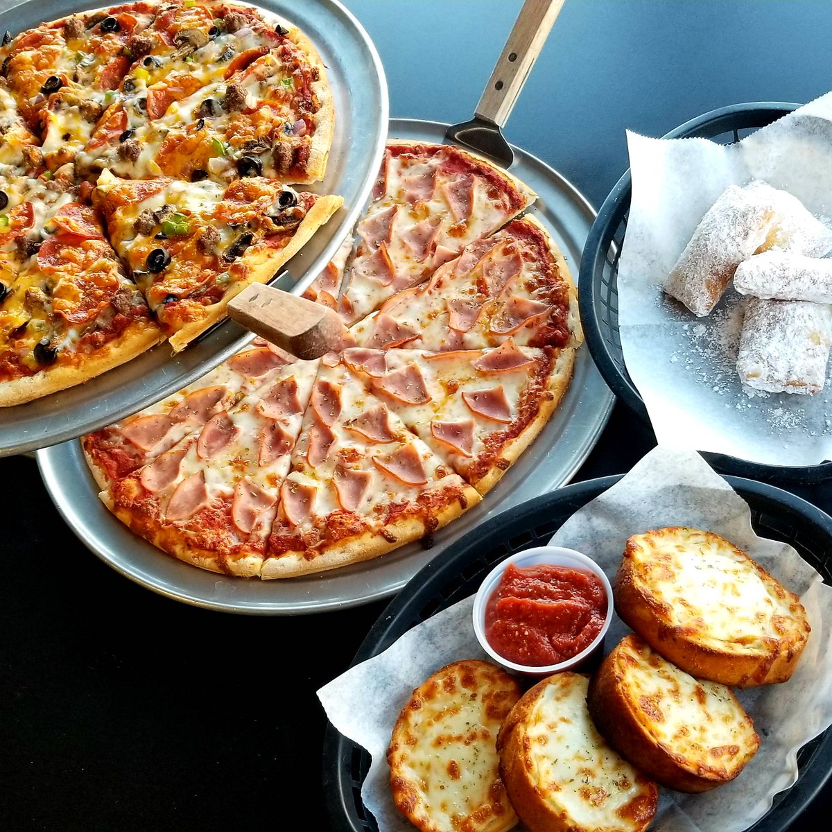 RPizza_Verm's tweet photo. We're still here!💁‍♀️🙃🍕🤗 
For this weekend only, we are offering our Family Deal [14" Specialty Pizza + 14" 1-Topping Pizza + Garlic Cheese Bread = 30.00] with a sweet little bonus: FREE order of our new Zeppole [ ZEP-oh-lee /Italian donuts] 
Add zeppole to any order for $5 https://t.co/3KUo3yT9Cd