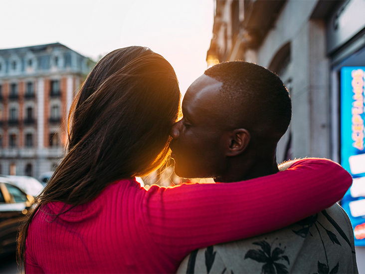 Girlfriend kissing petite street