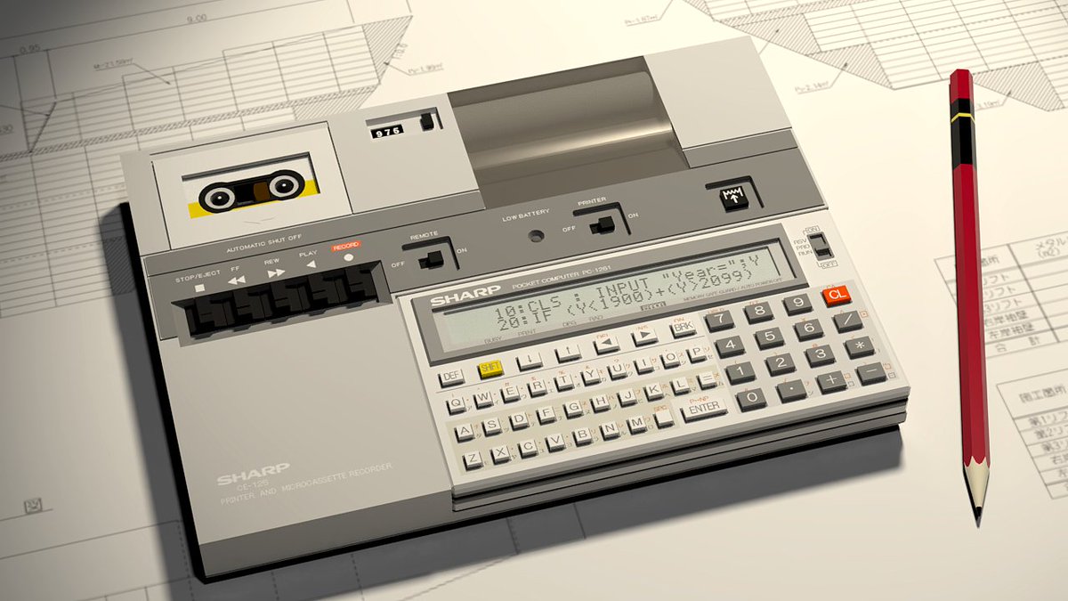 高校の教頭先生からもらった昔のポケットコンピュータを手にしている