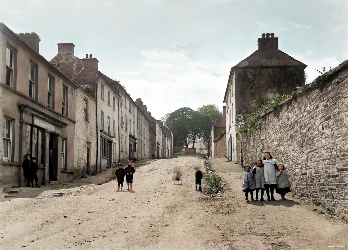 RobCross247's tweet photo. Bringing the lost history of Ireland to life!
My restored &amp; colourised 1910 photo of Main Street, Castletownshend, Co. Cork featuring the local children
and William Donovan's Pub on the left-hand side.
Google Street View🧐
https://t.co/2HcnsFSvoI
#Cork #Dublin #Ireland #DeOldify https://t.co/Irq9jloV7e