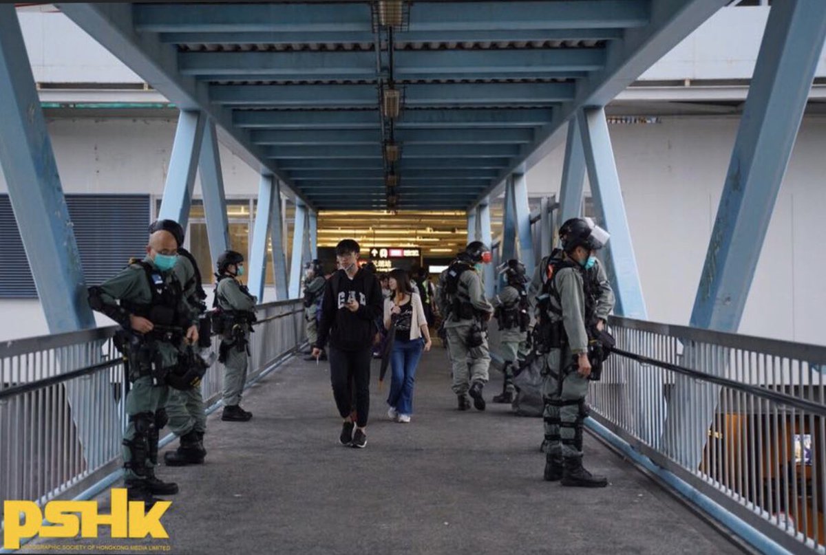 Today marks the eight-month anniversary since the July 21 #YuenLongAttack in 2019. While the train station is partially closed, a large number of #HKPolice have stationed outside the station. One of them was seen carrying a M16A1 rifle on guard.