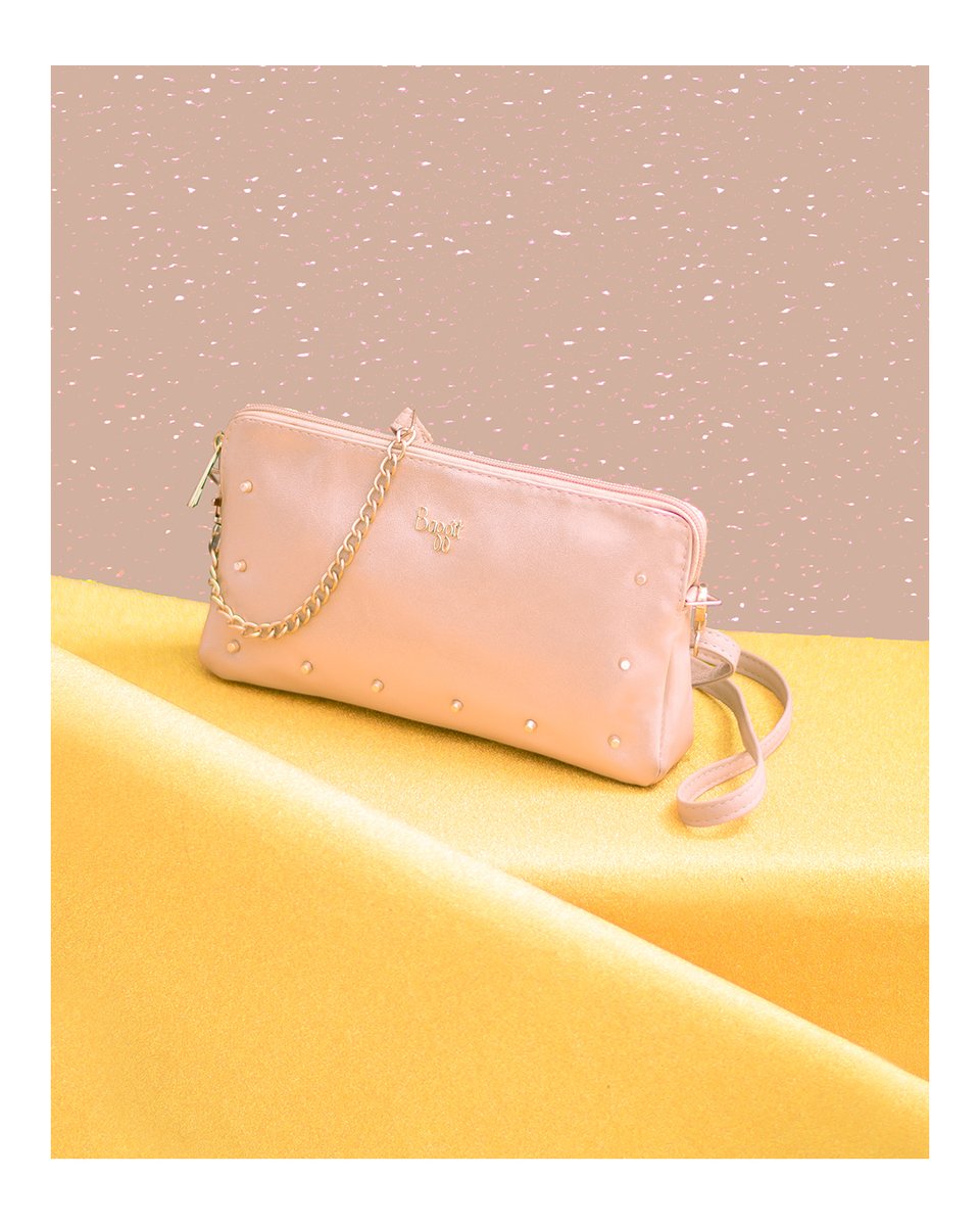 baggitworld's tweet photo. The L ARKAY by Baggit in a sweet pink hue and studded embellishment is sure to make an impression wherever you step out with it. #wristlet #partysling #MetallicCollection #fashiontrends https://t.co/NfoPhdfpmq