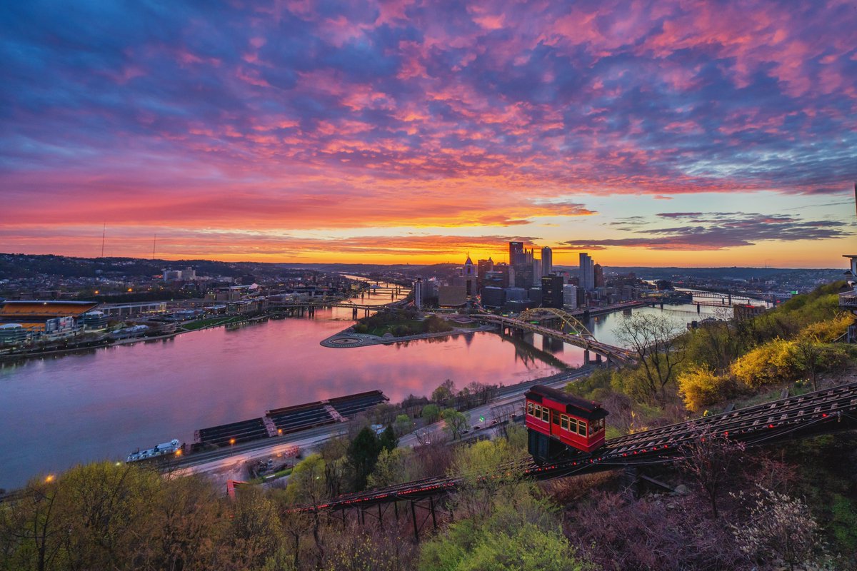 DaveDiCello's tweet photo. One of my recent projects has been cleaning up my archives, and I'm not sure why I never shared this view from last year. It was an incredible sunrise over #Pittsburgh just as the leaves were starting to return to the trees, with the colorful sky reflecting in the rivers as well. https://t.co/SXOWBK37eN