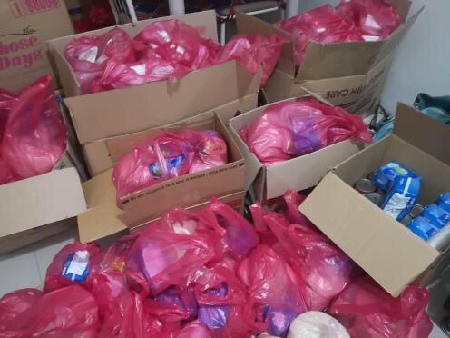 Collecting, purchasing, repacking and distribution of the #CollectiveCaring pack mini grocery with sanitary pads included