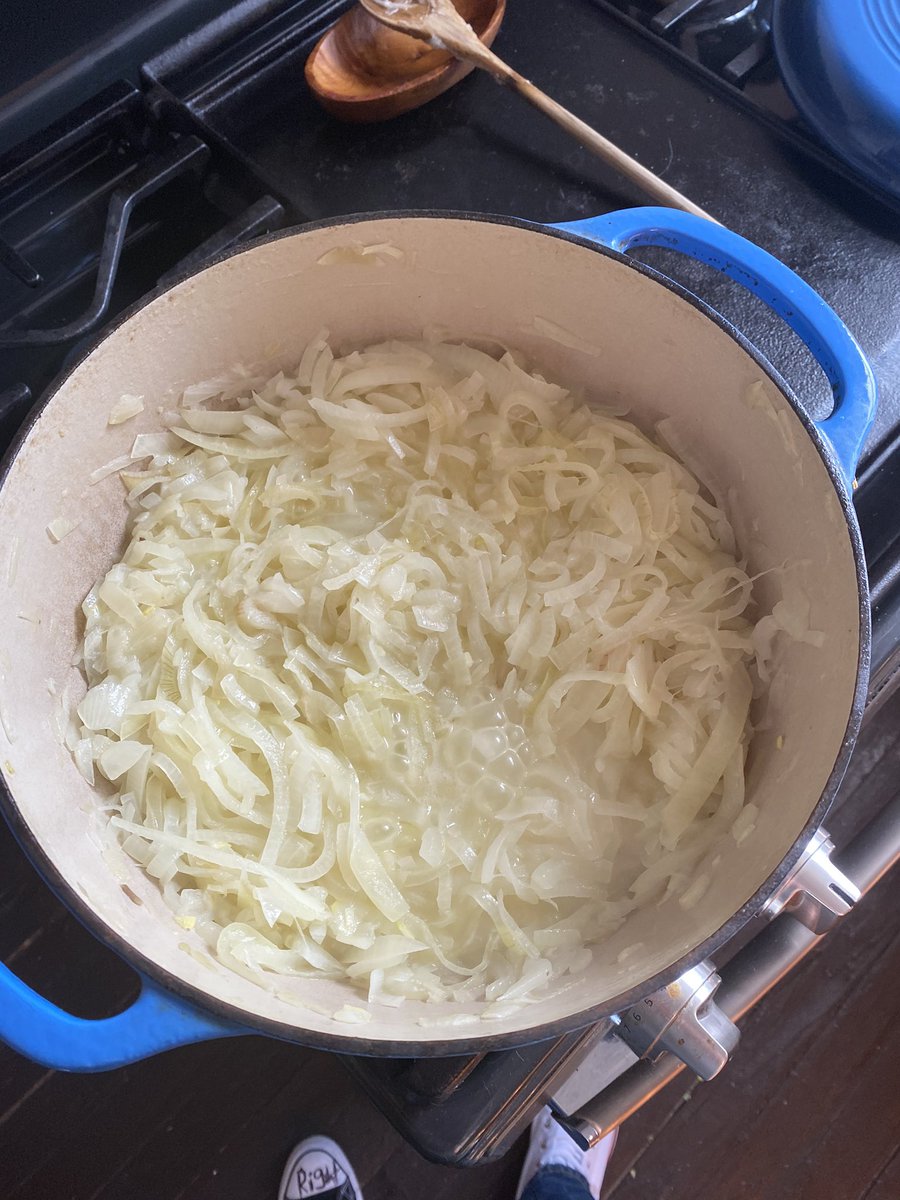 Salt is drawing all the water out of the onions. Once we cook this liquid off then we can raise the temp a teeny bit and start to pick up color. Lid should be off and you should be stirring occasionally.